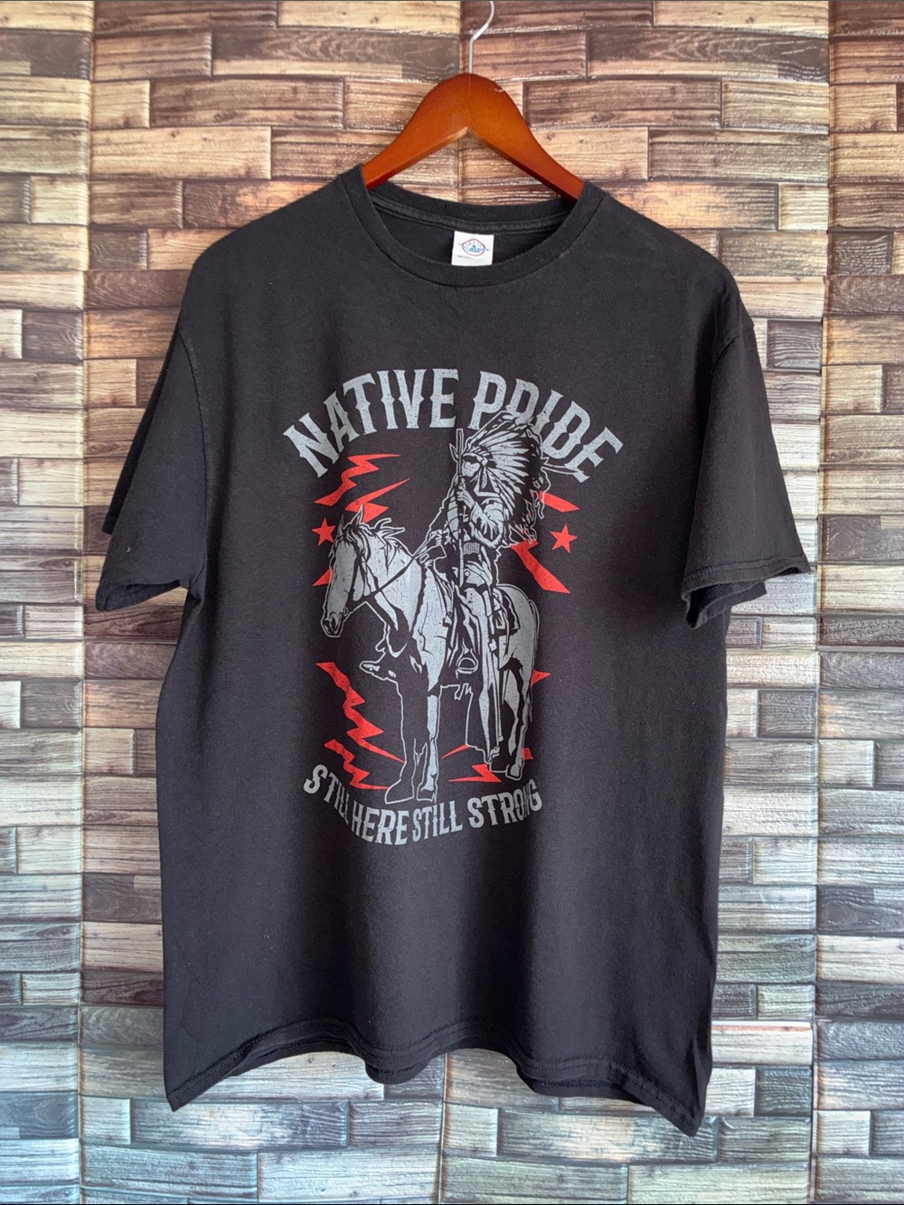 Unisex EUC Delta Large Native Pride Black Graphic Tee “Still Here Still Strong"
